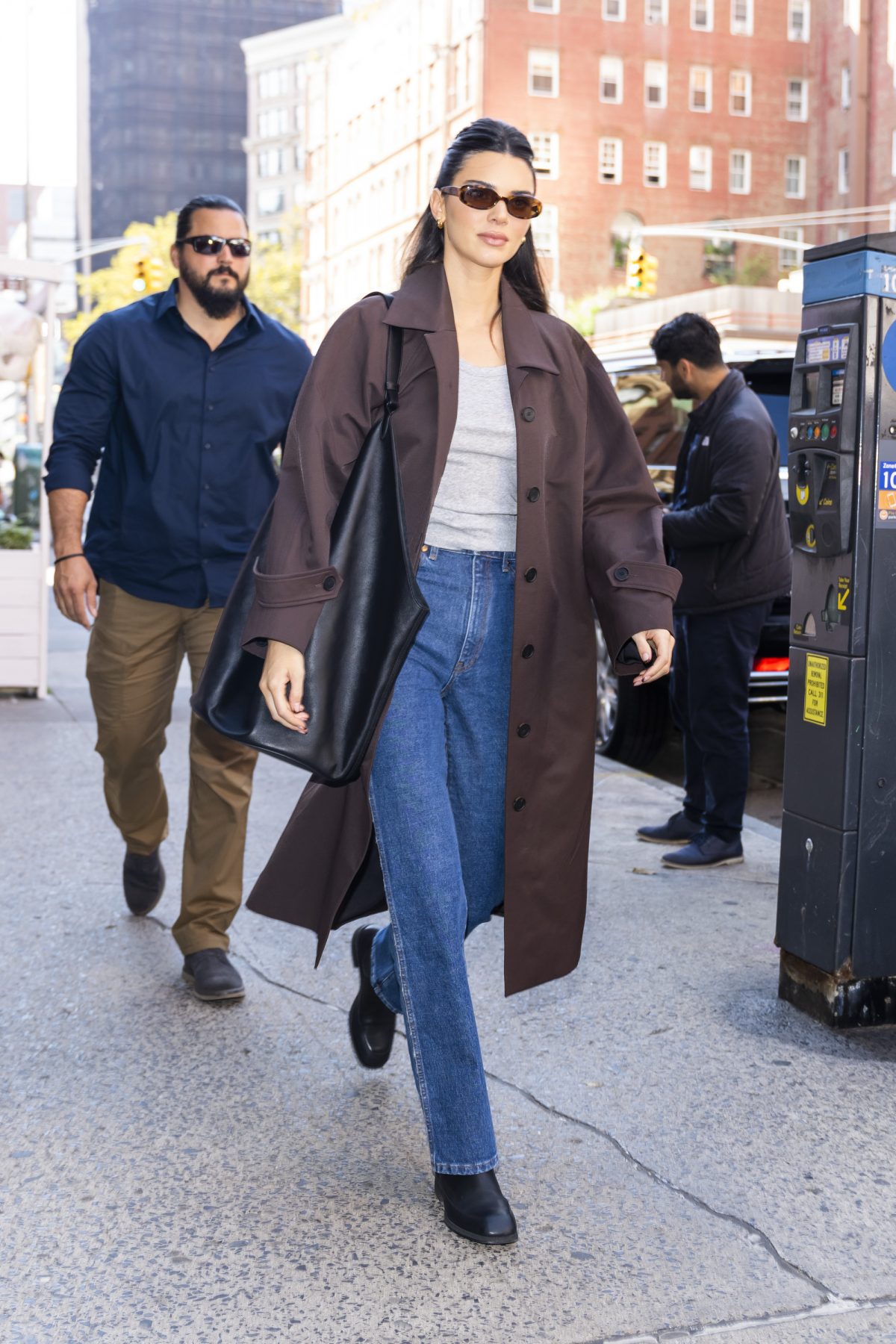 Kendall Jenner Wears Dr. Martens Boots + Yellow Hoodie in NYC